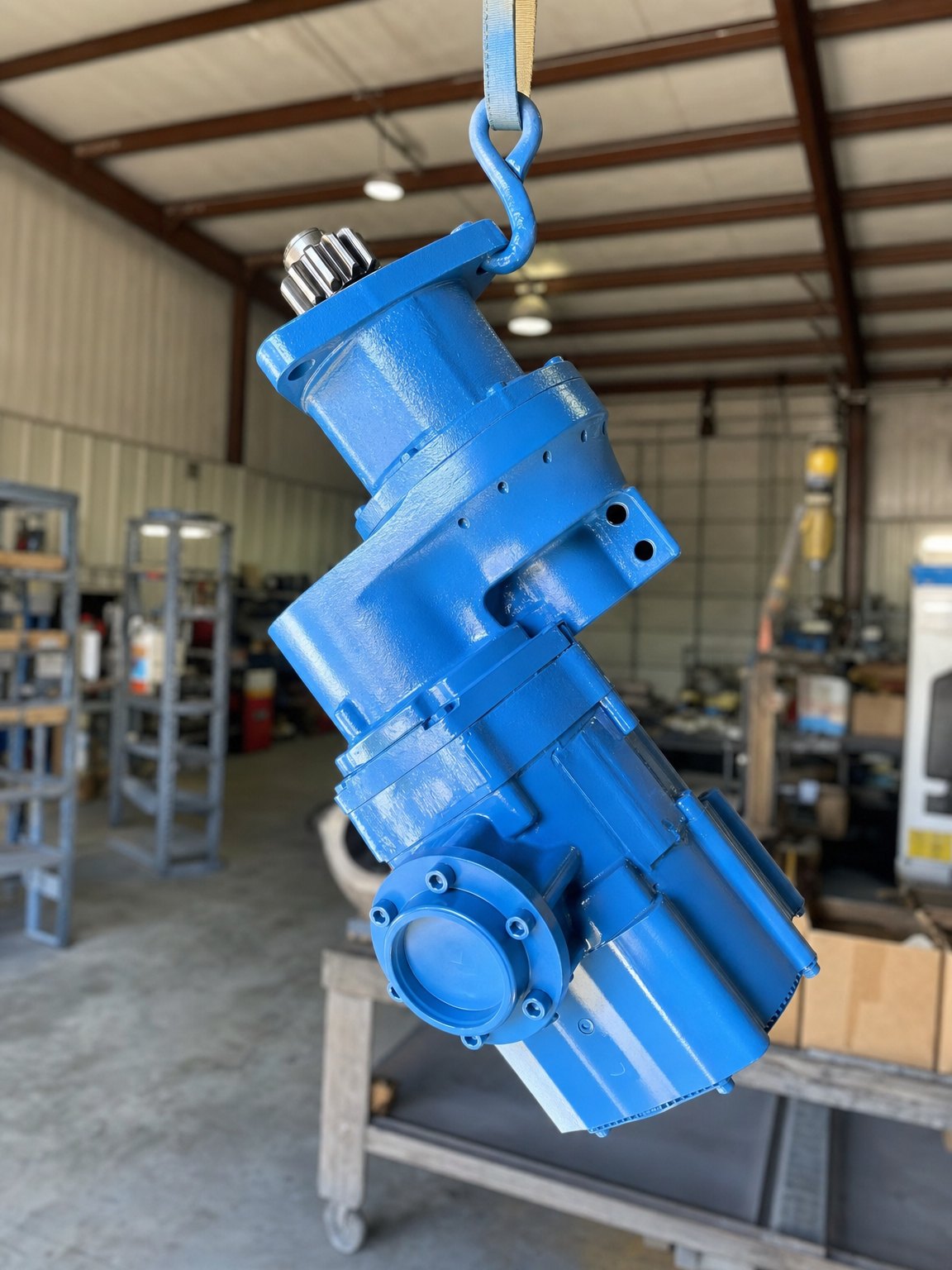 Rebuilt air starter lifted on a hoist in the ISS Odessa shop